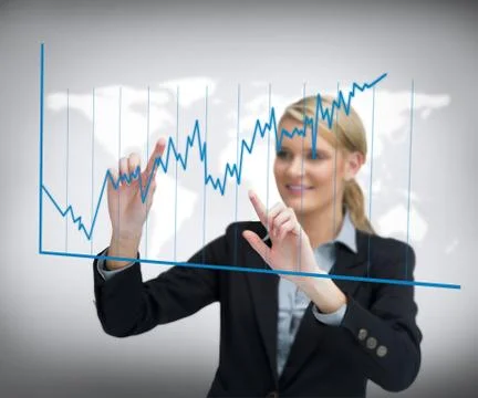Smiling businesswoman using curve on touch screen Stock Photos