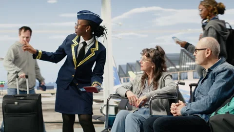 Smiling cabin crew member assisting elderly passenger with mobility aid Stock Footage 343742796
