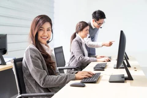 Smiling call Center working Foto stock