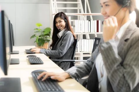 Smiling call Center working Stock Photos
