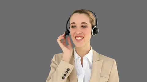 Smiling call centre agent talking on the headset Stock Footage 34680596
