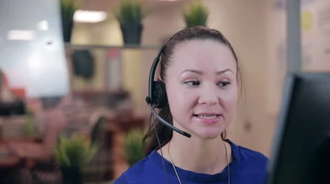 Smiling call centre operator, agent working in a bright helpline support Video stock 64983868