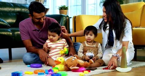 Smiling at camera together, Indian twin infants, young parents pose for photo Video stock 342777549