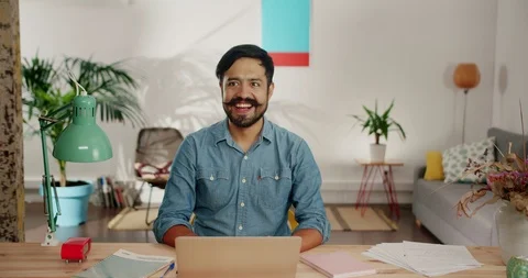 Smiling casual guy feeling happy about positive result excited moving hands up Stock Footage 120744790