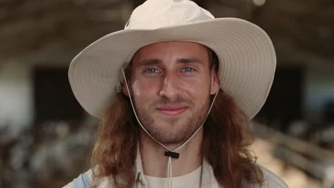 Smiling caucasian man in hat posing at goat farm. Close up Stock Footage 157562209