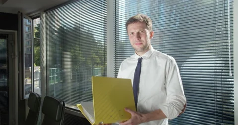 Smiling caucasian men intern standing at modern office coworking space Stock Footage 157734547