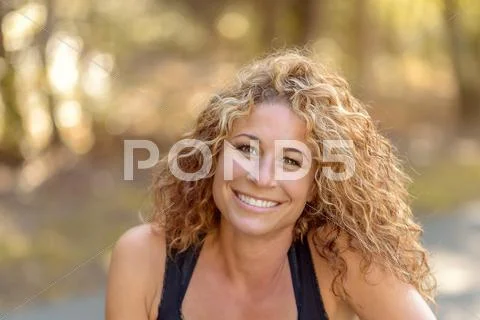 Smiling charismatic young woman Stock Photos