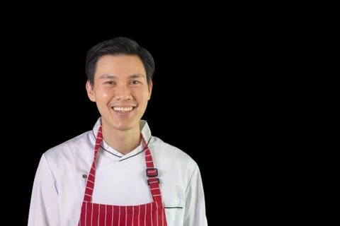 Smiling chef with clipping path on black background Фото