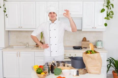 Smiling chef cooking a vegetable stew Stock Photos