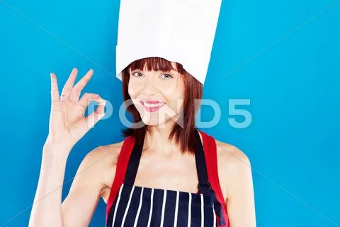 Smiling chef giving perfection gesture Stock Photos