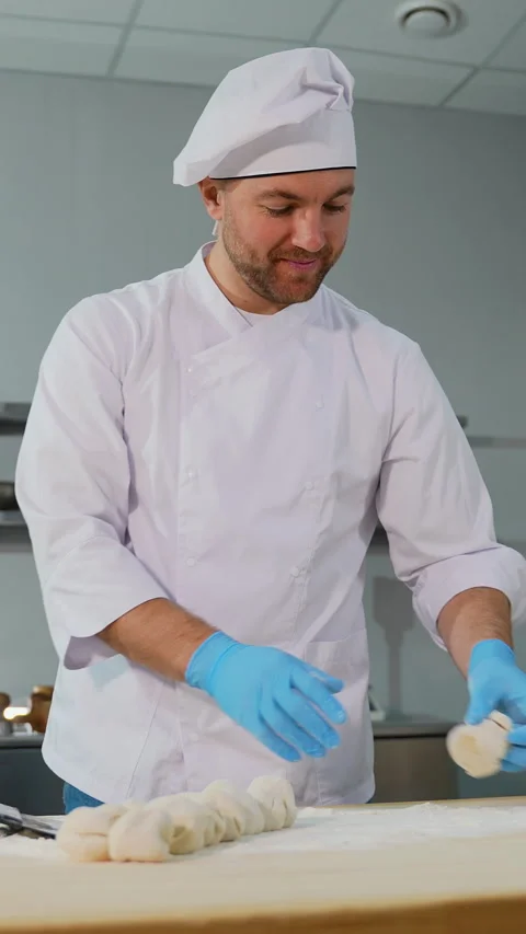 Smiling Chef Preparing Dough in Kitchen Video stock 299664691