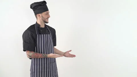 A smiling chef says hello to the camera Stock Footage 143655853