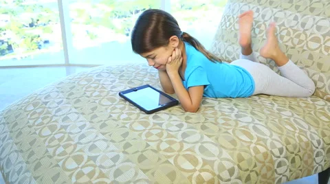 Smiling child learnng on a tablet Stock Footage 46296199