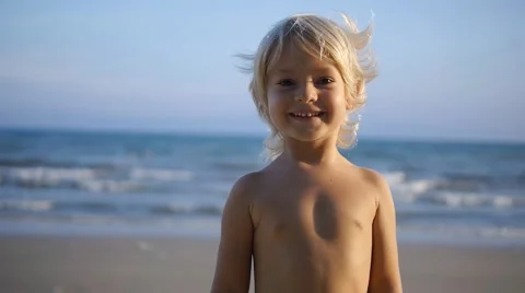 A smiling child making grimace, poking fingers to camera in slow motion Stock Footage 50147804