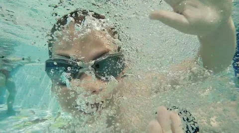 Smiling child swimming with fun Stock Footage 62637467