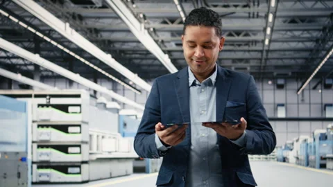 Smiling cleanroom operator holding delicate electronic component Stock Footage 333392387