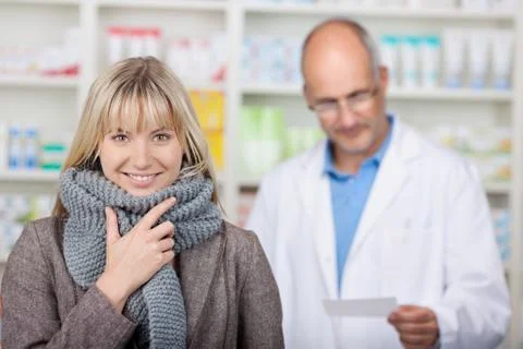 Smiling client with scarf in pharmacy Stock Photos