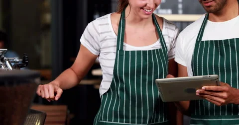 Smiling co-workers using tablet Stock-Footage 58575388