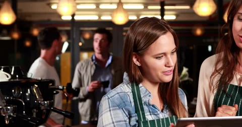 Smiling co-workers using tablet Stock-Footage 58577340