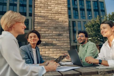 Smiling colleagues working together developing business strategy for project on Stock Photos