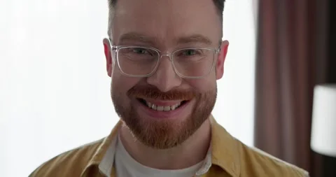 Smiling confident man with eyeglasses looking in camera, standing in front. Stock Footage 249465709