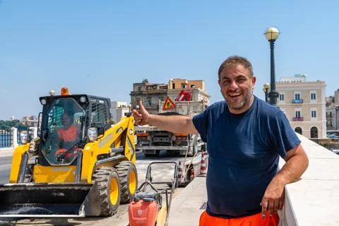 Smiling Construction Worker Giving Thumbs Up in Taranto Stock Photos