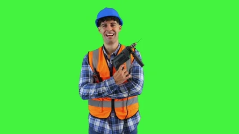 Smiling construction worker holding a power drill, wearing orange vest and .. Stock Footage 286986026