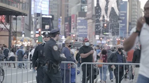 Smiling Cop in Time Square during 2020 Biden presidential election celebration Stock Footage 142724411