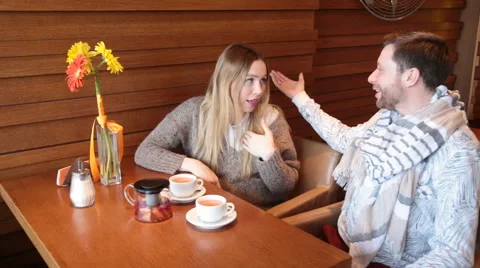 Smiling couple in a cafe Stock Footage 62685130