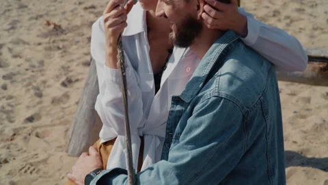 Smiling Couple Cuddling on Beach Swing Stock Footage 328560795