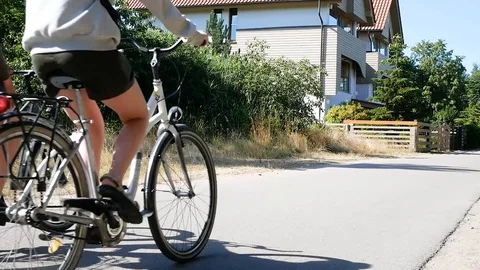 Smiling couple cycling through a forest together, close up Stock Footage 127488581