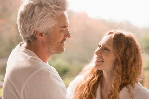 Smiling couple face to face Stock Photos