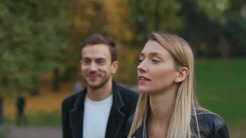 Smiling couple having fun outdoors laughing joyful girl girlfriend nature park Stock Footage 102744209