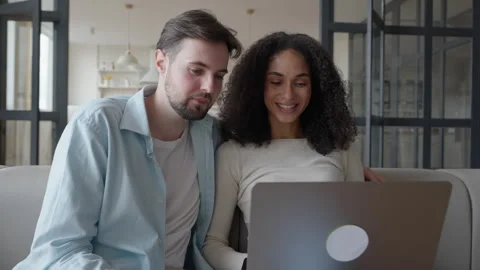 Smiling Couple Having Video Call Together On Laptop At Cozy Home Interior Видео 318930670