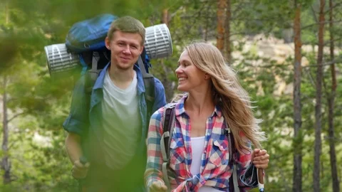 Smiling couple hiking in forest Stock Footage 118545146