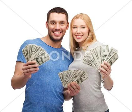 Smiling couple holding dollar cash money Stock-Fotos