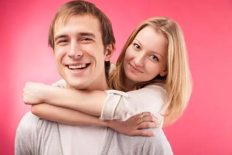 Smiling couple hugging, looking in the camera Stock Photos