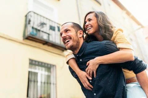 Smiling couple of lovers having fun. Stock Photos