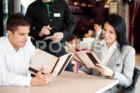 Smiling couple orders a meal Stock Photos