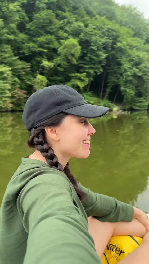 Smiling couple on supboard floating by river Stock Footage 248428126
