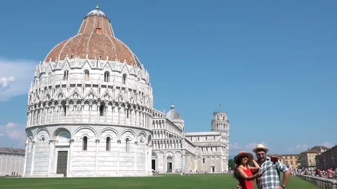 Smiling couple taking selfie in front of famous Italian monument of Pisa tower Stock Footage 103792065
