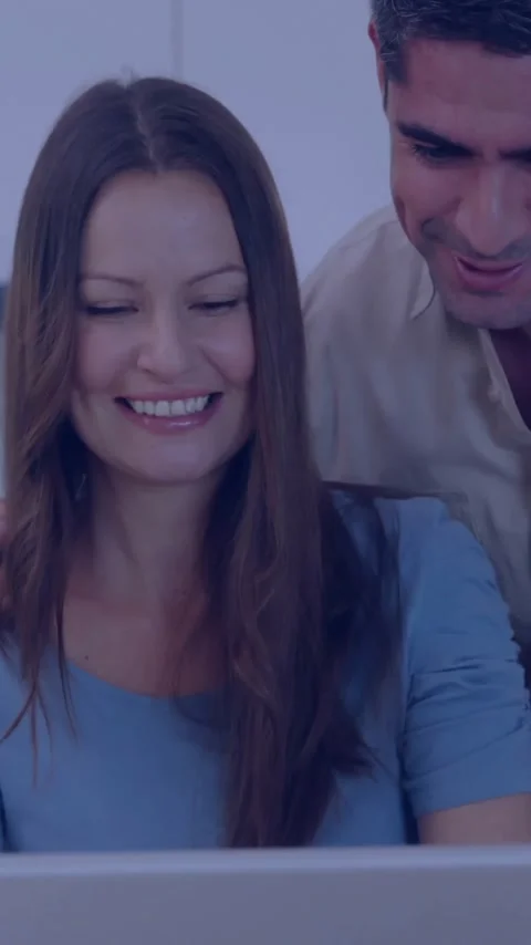 Smiling couple using laptop, surrounded by digital network connection animation Stock Footage 341956911