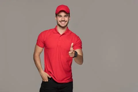 Smiling courier man posing in studio. Foto stock