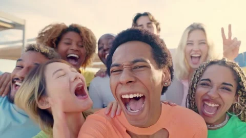 Smiling crazy multi-ethnic people taking selfies during sunset Video stock 262955739