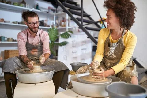 Smiling creative artists making Handmade pottery in studio. Creative, hobby.. Stock Photos