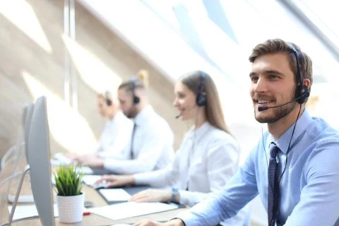 Smiling customer support operator at work. Foto stock