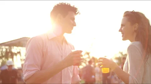 Smiling, dancing couple toasts and drinks Stock Footage 63075472