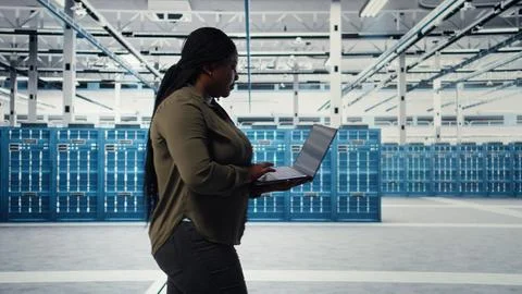 Smiling data center engineer pleased after minimizing downtime Stock Photos