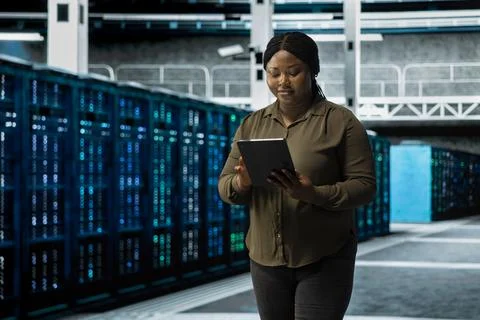 Smiling data center programmer conducting tests on equipment Stock Photos