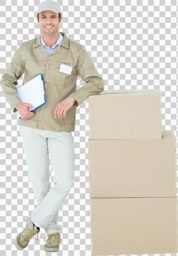 Smiling delivery man standing by stack of boxes Foto stock